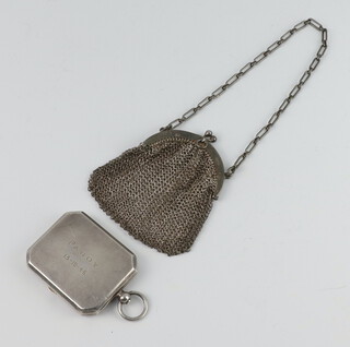 An octagonal silver match case with engraved inscription Birmingham 1938 together with a silver mesh purse 88 grams 