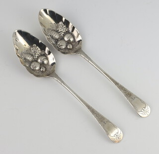 A pair of Georgian silver berry spoons with engraved decoration (rubbed marks) 138 grams 