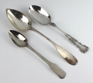 A Continental white metal fiddle pattern serving spoon and 2 others 
