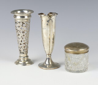 A silver fluted spill vase Birmingham 1911, 14cm, a pierced ditto and a lidded jar 