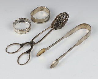 A silver napkin ring Birmingham 1991, 1 other, a pair of Georgian silver sugar nips 53 grams and a pair of white metal servers 