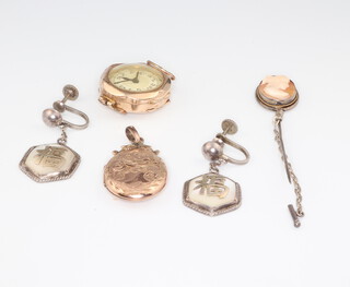 A lady's 9ct yellow gold cased wristwatch, a locket, a pair of screw back earrings and cameo set tie pin 
