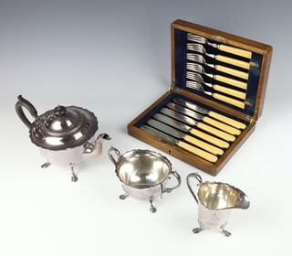 A silver plated 3 piece tea set with ebony mounts and a cased set 