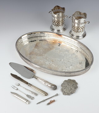 An oval silver plated galleried tray and minor plated wares 
