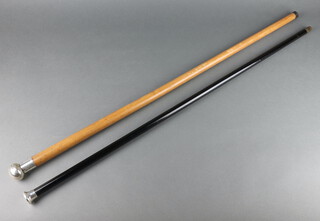 A Victorian style ebony walking cane with silver knop, a hardwood ditto 