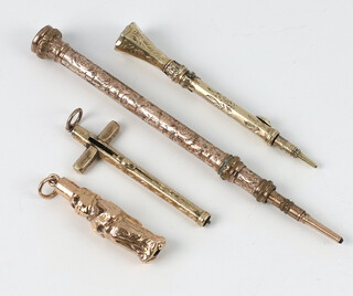 A novelty gilt propelling pencil in the form of a standing figure, 3 others 