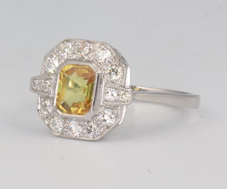 A yellow metal stamped 750 yellow sapphire and diamond Art Deco style ring, the centre stone 1.5ct, the brilliant cut diamonds 0.5ct, 4.9 grams, size O 1/2