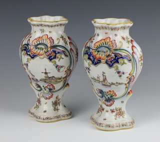 A pair of Delft polychrome vases decorated with scenes of windmills and boats 24cm 