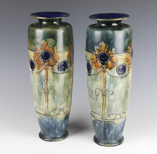 A pair of Royal Doulton vases decorated with stylised flowers 35cm 