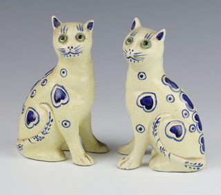 A pair of Galle style ceramic cats with glass eyes and blue heart decoration 14cm 