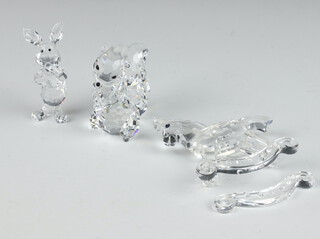 A Swarovski Crystal figure of Piglet by Mario Dilitz 910000082 6cm, ditto Bambi Series Flower Skunk 9100000113 5cm and a rocking horse by Gabriel Stamey 7479000001 4cm (1 rocker detached), all boxed 