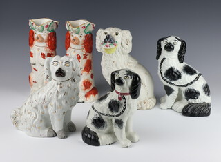 Two Victorian Staffordshire jugs in the form of seated Spaniels 26cm, four other Victorian Staffordshire Spaniels 