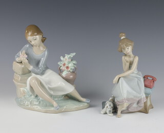A Lladro group of a girl holding a rose 20cm together with a ditto of a girl with hound and telephone 5466 19cm 