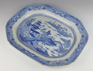 A 19th Century Masons ironstone octagonal meat plate with willow pattern decoration 50cm 