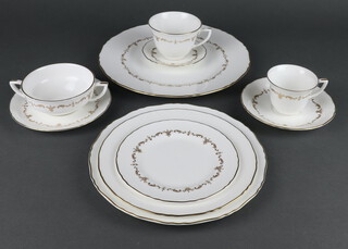 A Royal Worcester Gold Chantilly tea and dinner service comprising 12 small tea cups, 12 large tea cups, 10 two handled bowls, 11 dinner plates, 10 medium plates, 12 small plates, 12 side plates, 12 small saucers, 12 medium saucers, 10 medium saucers
