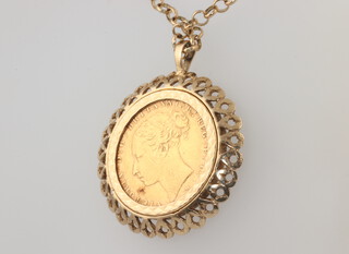 A Victorian sovereign 1880 in an 11.6 grams 9ct mount and chain
