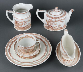 A Furnivals Quail pattern part dinner/tea service comprising teapot, serving plate, 9 dinner plates, 10 saucers, 6 dessert bowls, 9 side plates, 7 sandwich plates, 8 cups, vegetable dish, sauce boat and stands, 6 small soup bowls, 2 oblong dishes, 2 small dishes and a jug 