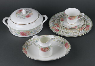 A Royal Doulton Claudia pattern part tea and dinner service comprising 10 tea cups, 10 saucers, 11 small plates, 10 side plates, 10 dinner plates, 8 soup bowls, 2 vegetable dishes, meat dish, tureen and cover, milk jug, cream jug, 2 bowls  