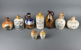 A Doulton Lambeth Special Highland Whisky flagon and 8 other advertising vessels 