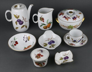 A quantity of Royal Worcester Evesham tableware comprising coffee pot, milk jug (chipped), 1 large tea cup, 4 small tea cups, 4 saucers, 4 small plates, 4 side plates, 4 dinner plates, 4 dessert bowls, 3 vegetable dishes, a lidded jar and cover, leaf shaped dish, vegetable dish and cover, spare cover, 2 condiments, 4 ramekins, 2 section dish, rectangular dish and a meat dish 