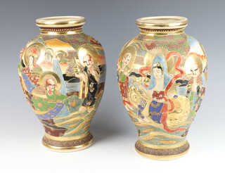 A pair of mid-Century Japanese Satsuma vases decorated with figures 30cm 