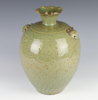 A Chinese Celadon baluster vase with incised floral decoration and lion mask handles with wavy rim 30cm 