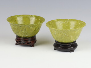 A pair of green resin bowls with flared rims 10cm 
