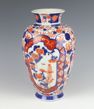 A late 19th Century oviform Imari vase decorated with panels of insects and flowers 30cm 