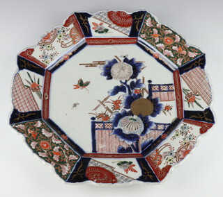 A 19th Century Imari octagonal shallow dish decorated with insects amongst peony with panels of flowers and scrolls 45cm 