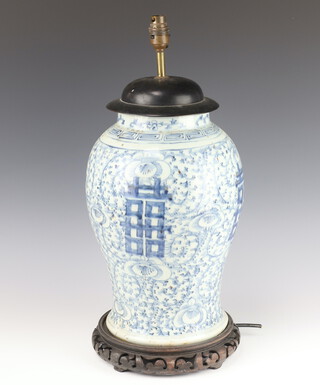An 18th Century style blue and white Chinese baluster jar converted to electricity with wooden mounts 35cm 