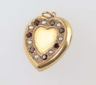 A 9ct yellow gold garnet and pearl heart locket 3.8 grams, 20mm 