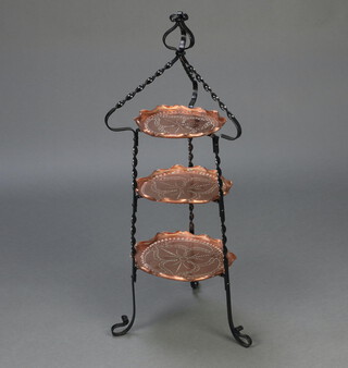 A Victorian Art Nouveau embossed copper and wrought iron circular 2 tier graduated cake stand 90cm h x 28cm diam.