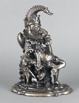 A Victorian style cast iron door stop in the form of a seated Mr Punch 30cm x 23cm x 9cm  