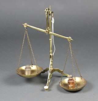 Doyle & Sons, a pair of gilt metal bank scales together with 3 weights 54cm x 35cm 