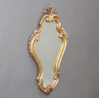 A Rococo style shaped plate wall mirror contained in a gilt painted frame 54cm h x 32cm 