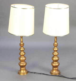 A pair of gilt metal table lamps 62cm x 13cm 