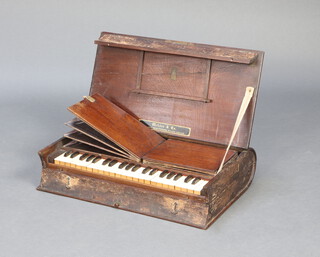Metzler & Co. 37 Marlborough Street, London, a folding 'missionary' organ, contained in an oak bible shaped case 13cm h x 59cm w x 35cm d   