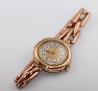 A lady's 9ct yellow gold wristwatch and expanding bracelet 21.6 grams gross with movement and glass 