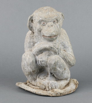 A 19th/20th Century cast lead figure of a seated monkey  27cm x 19cm x 18cm 
