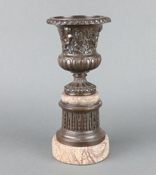 A Georgian style cast bronze urn raised on a polished marble base 33cm h x 14cm diam. 