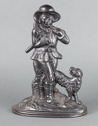A Victorian style cast iron door stop of a sanding woodsman with dog on an oval base 33cm x 23cm x 6cm 
