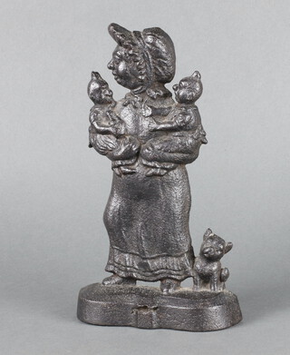 A Victorian style cast iron door stop in the form of a standing mother, child and dog 30cm h x 15cm x 5cm 