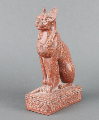 After the Antique, a carved red hardstone figure of an Egyptian seated cat 27cm x 16cm x 8cm 