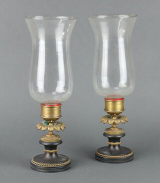 A pair of Regency style gilt bronze and dulled bronze storm lanterns with glass shaped shades 30cm h x 6cm w x 9cm d 