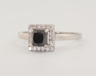 A white metal plat. treated black diamond and diamond cluster ring, the centre stone 0.6ct, the brilliant cut diamonds 0.20ct, size L, 3.8 grams, together with a WGI certificate 
