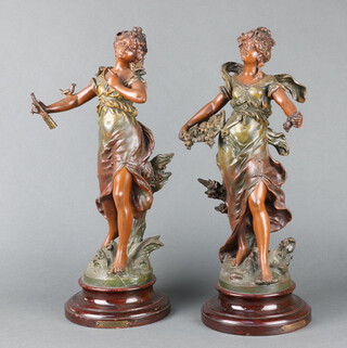 A pair of 19th Century French spelter figures Charmeuse and Jeunesse, raised on turned wooden bases 43cm h x 16cm 