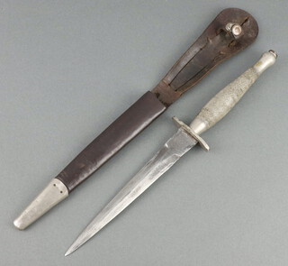 A Fairbairn Sykes first pattern fighting dagger, the 16.5cm blade marked Wilkinson Sword & Co Ltd, London, The Fairbarin Sykes Fighting Knife, complete with leather scabbard 