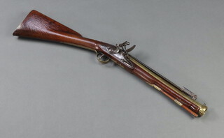 Norman of Uffculme, a flintlock brass barrelled blunderbuss, the 36cm barrel with steel sprung bayonet, marked Uffculme and with 2 proof marks, the steel lock marked Norman with walnut stock  