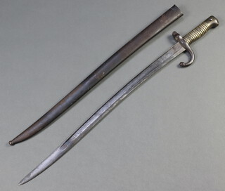 A chassepot bayonet complete with scabbard, the blade dated 1873