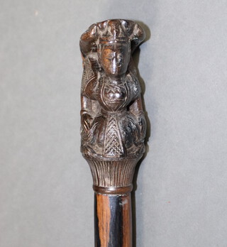 A walking stick with carved Eastern hardwood terminal on a rosewood shaft, the terminal carved a figure of a mythical beast 